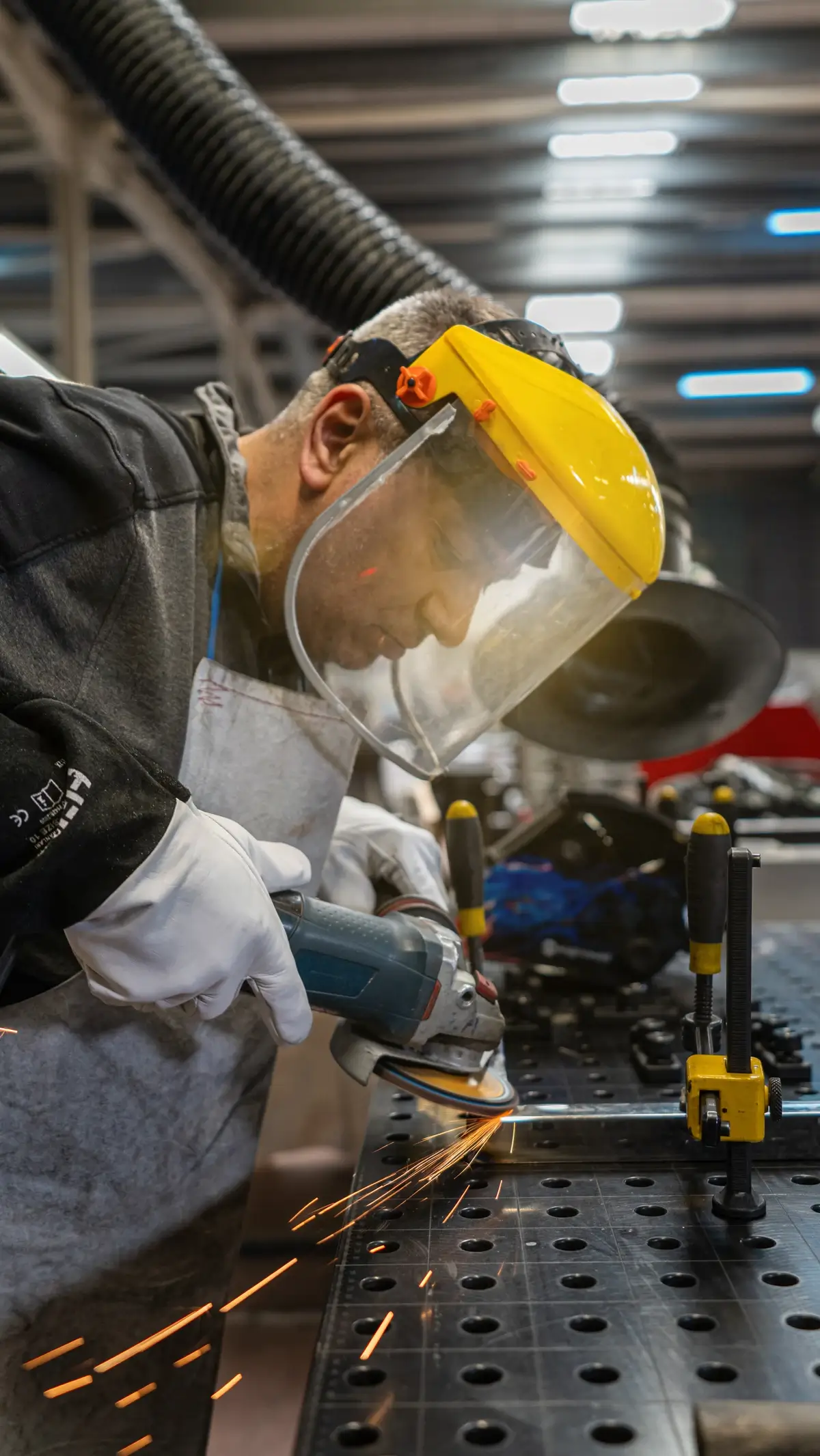 A craftsperson working in the production facility