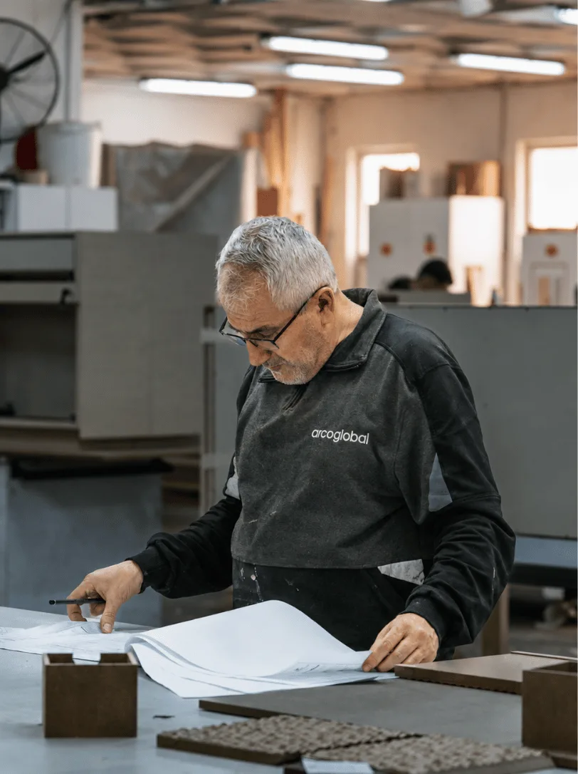 An arcoglobal team member inspecting a finished panel